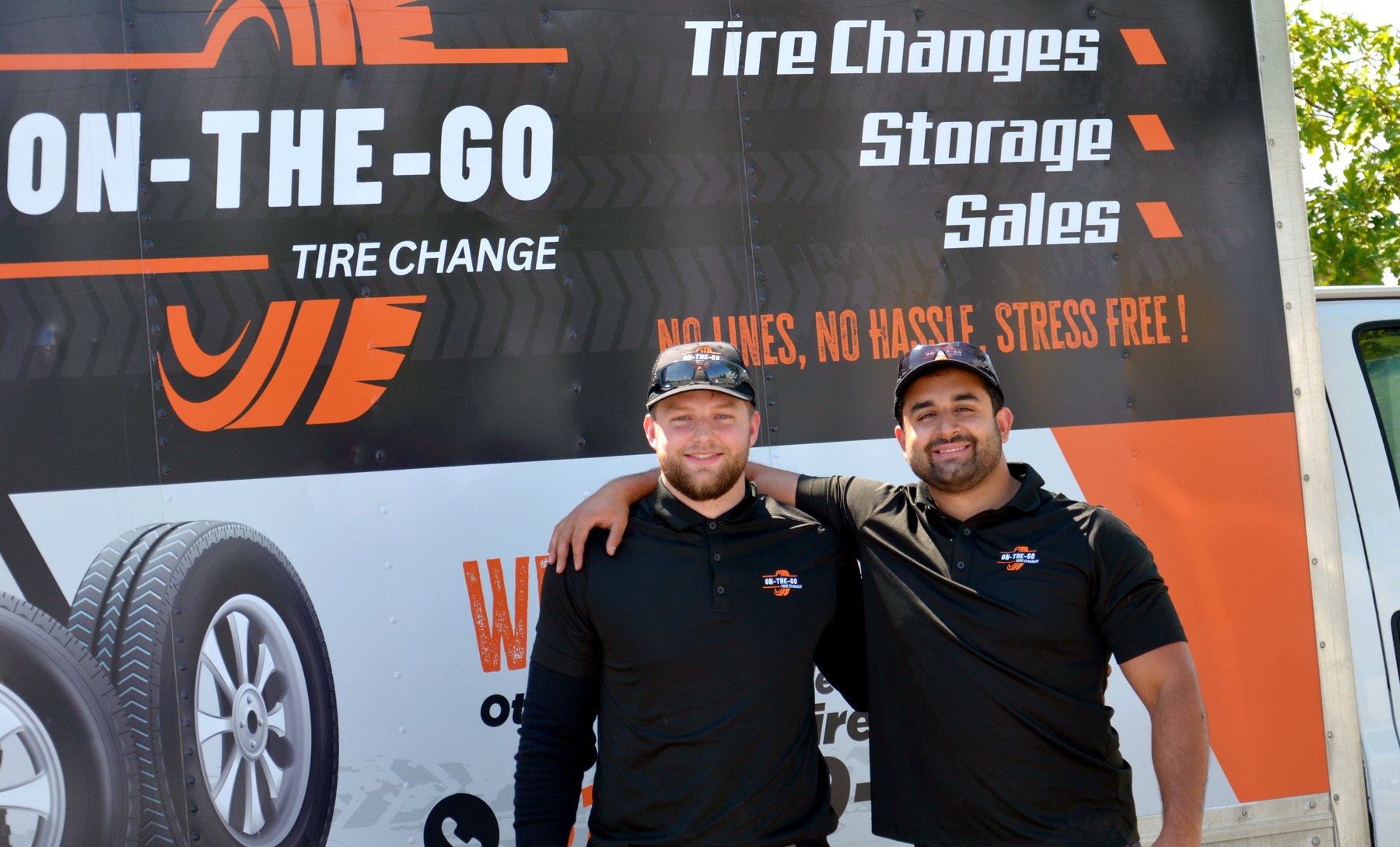 The On The Go Tire Change crew in front of their mobile service truck